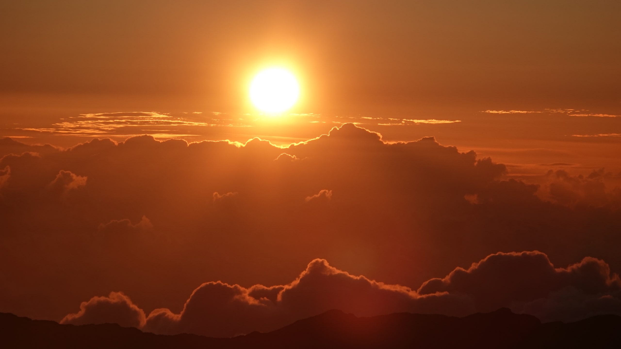 Haleakala national park sunrise mountain clouds